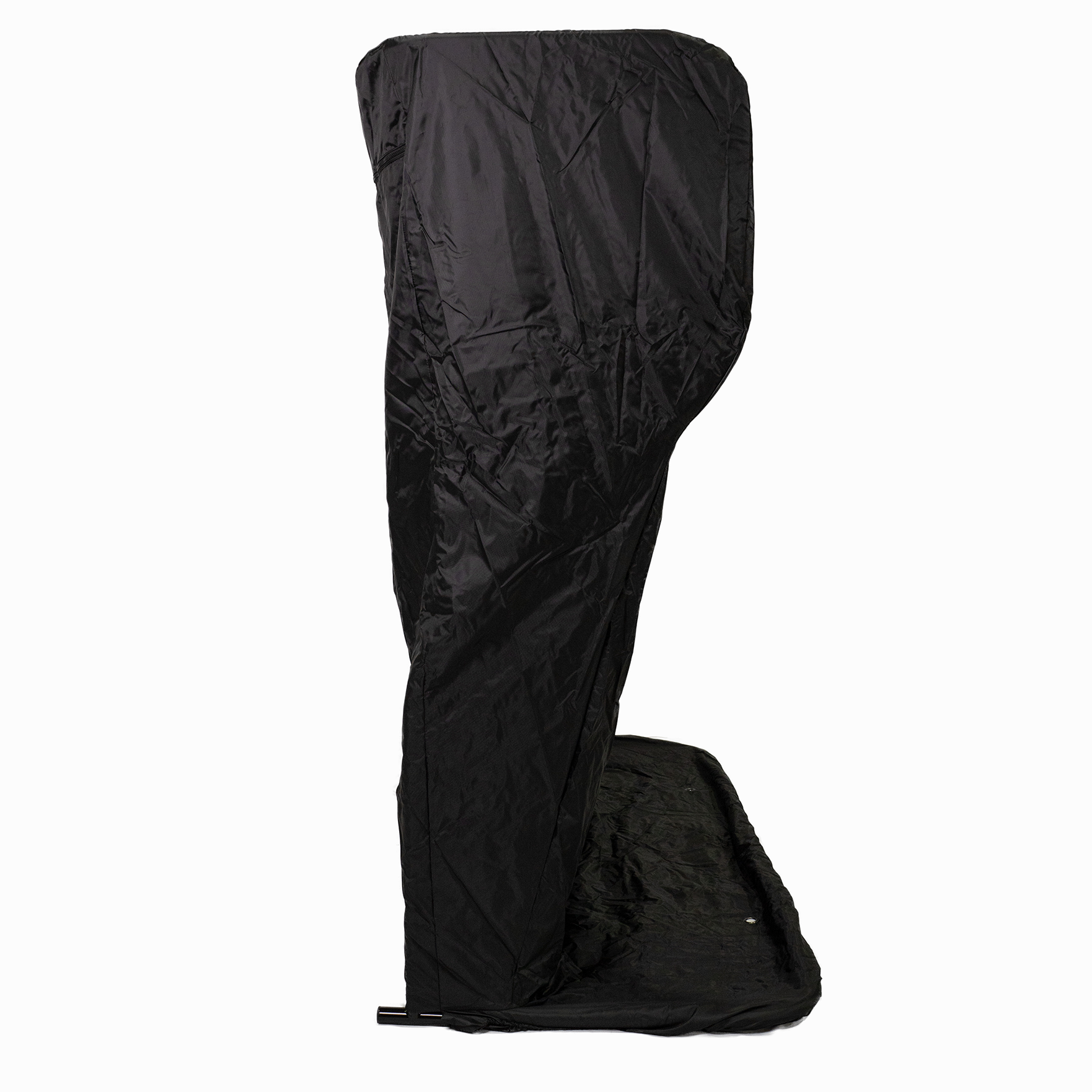 A tall, black, fabric-covered object with a curved top, resembling a standalone privacy or dressing tent.